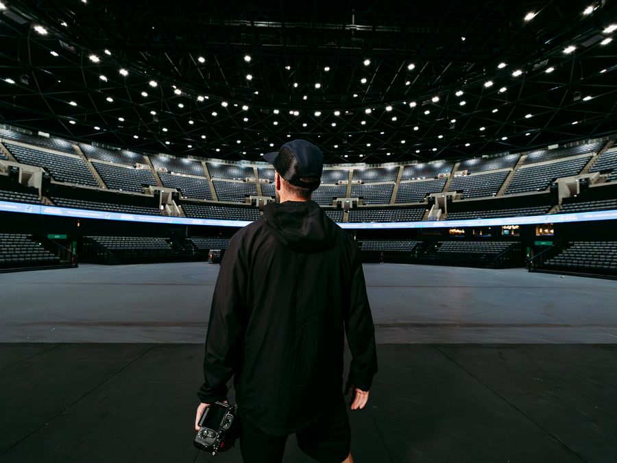 Greg filming content in the empty OVO Hydro arena
