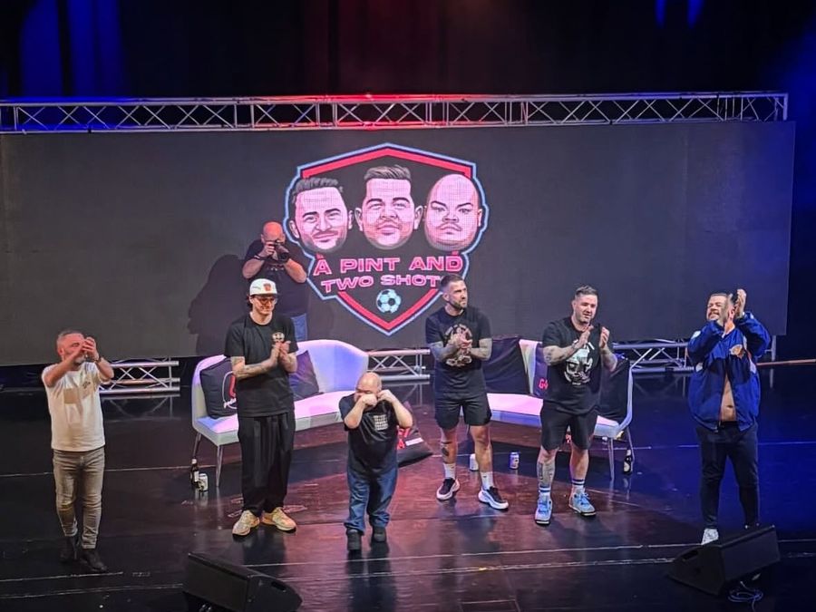 A Pint and Two Shots live show on stage
